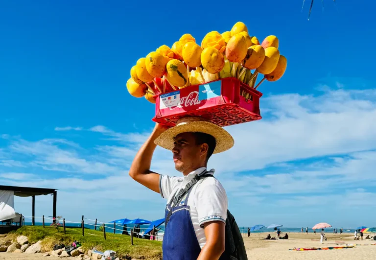 Beach vendor selling mangoes